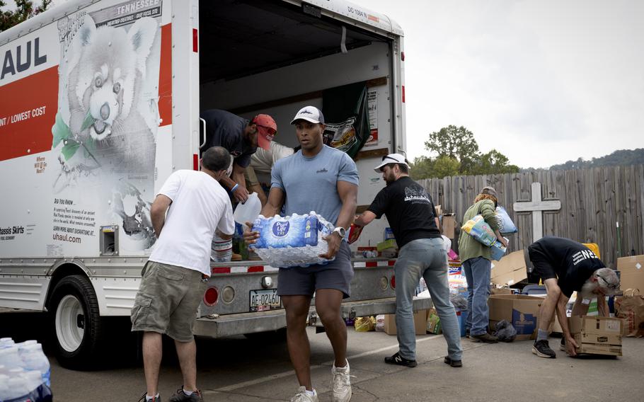 Supplies are loaded into vehicles.