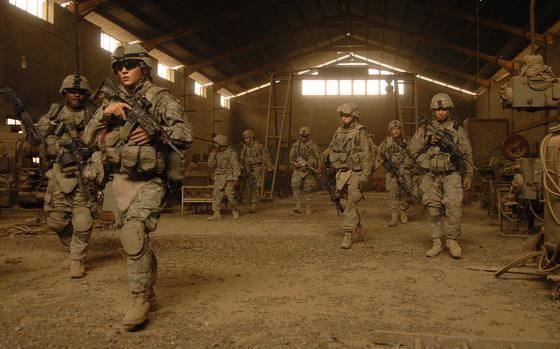 Sadr City, Iraq, June 6, 2008: Soldiers from 1st Platoon, “C” Company, Task Force 1st Battalion, 6th Infantry Regiment, exit an industrial building after conducting a search in the southern portion of Sadr City. 

 META TAGS: Operation Iraqi Freedom, War on Terror, U.S. Army, 