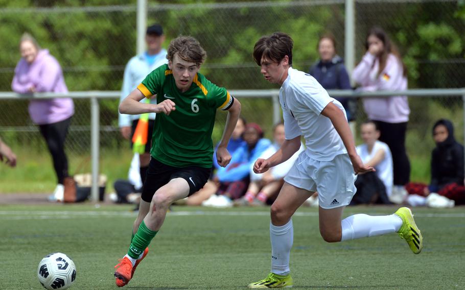 Alconbury’s Aaron Dudley passes to a teammate as Ansbach’s Brodie Kohrs defends. Ansbach beat Alconbury 7-1 in a Division III semifinal at the DODEA-Europe soccer finals in Landstuhl, Germany, May 22, 2024, and will face AFNORTH in Thursday’s final.