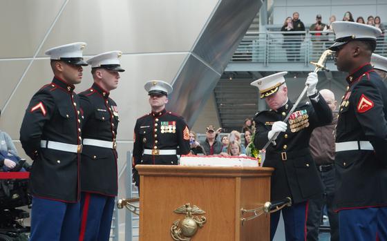 Col. (Ret.) Keil Gentry, director of the National Museum of the Marine Corps, cuts the birthday cake with a sword during a cake-cutting ceremony in honor of the 249th birthday of the U.S. Marine Corps at the National Museum of the Marine Corps, Nov. 10, 2024. 