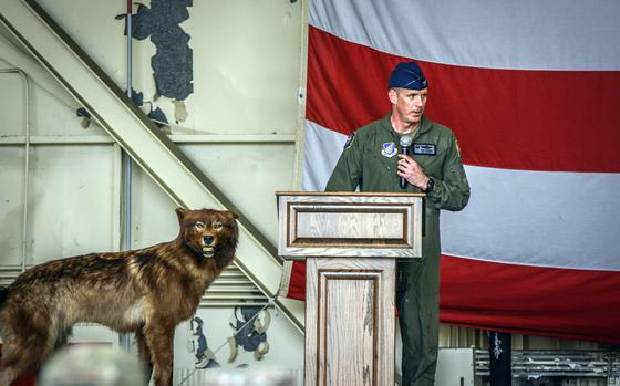 Col. Peter Kasarkis gives his inaugural speech as 8th Fighter Wing commander alongside the wing’s wolf mascot during a change-of-command ceremony at Kunsan Air Base, South Korea, June 7, 2024. 