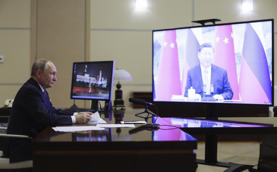 Russian President Vladimir Putin speaks with Chinese President Xi Jinping via videoconference at Novo-Ogaryovo state residence outside of Moscow, Russia, Tuesday, Jan. 21, 2025. (Gavriil Grigorov, Sputnik, Kremlin Pool Photo via AP)