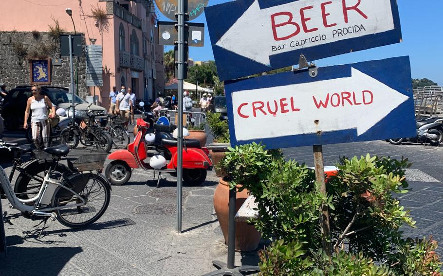 The waterfront near where ferries drop off visitors to Procida is filled with cafes and bars, including some with humorous signs to attract customers. 