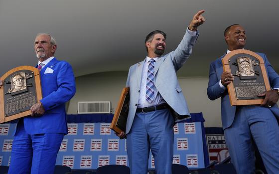 Baseball Hall of Fame inductees Jim Leyland, left, Todd Helton, center, and Adrián Beltré, right, holds their plaques at the National Baseball Hall of Fame induction ceremony, Sunday, July 21, 2024, in Cooperstown, N.Y. (AP Photo/Julia Nikhinson)