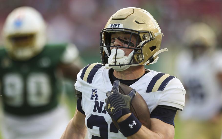 Navy running back Eli Heidenreich runs for a touchdown against South Florida on Nov. 9.