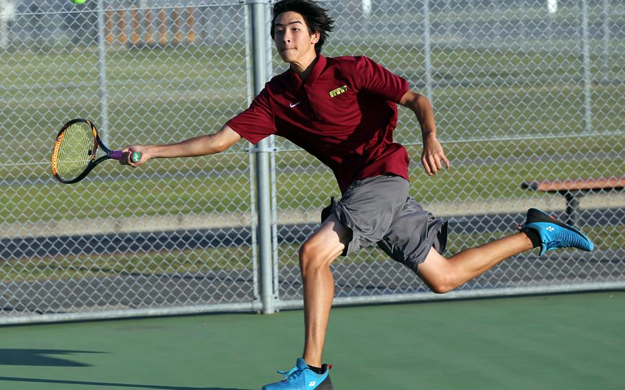 Matthew C. Perry's Max Bailey runs down the ball during this weekend's DODEA-Japan tennis matches. Bailey lost his singles and doubles matches to E.J. King.