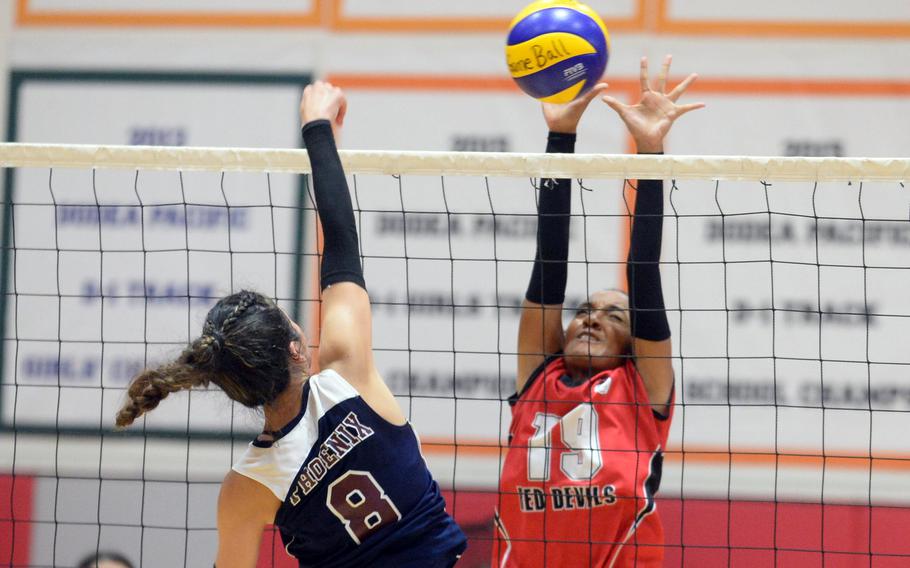 Seisen's Mariko Kurosawa spikes against Nile C. Kinnick's Alyssa Staples during the Phoenix's three-set Kanto Plain victory Saturday.