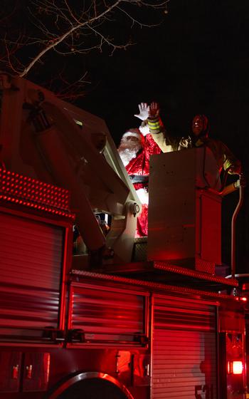 Santa Claus rides a fire truck at Marine Corps Base Quantico.