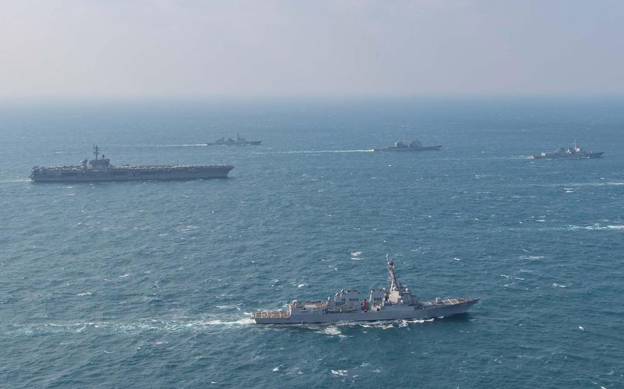 U.S. warships and ships from Japan and South Korea transit through the sea.