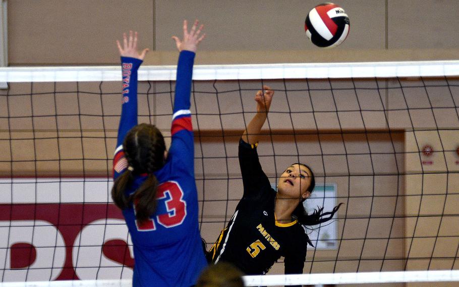 Brooklyn Biles spikes the ball.