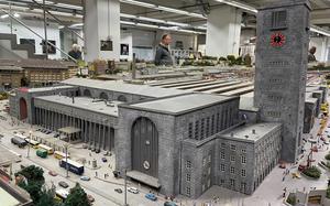 The Stuttgart main station, with its iconic Mercedes Benz symbol atop it, is the primary feature of the Miniature World Stuttgart museum's collection of models re-creating the 1980s look of the German city. 