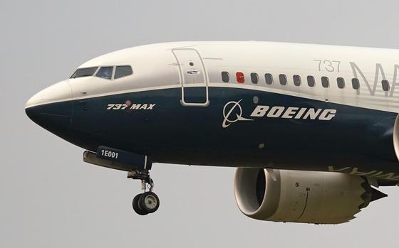 A Boeing 737 Max jet prepares to land at Boeing Field following a test flight in Seattle, Sept. 30, 2020. Boeing announced plans late Sunday, June 30, 2024, to acquire Spirit AeroSystems for $4.7 billion in an all-stock transaction for the manufacturing firm. (AP Photo/Elaine Thompson, File)
