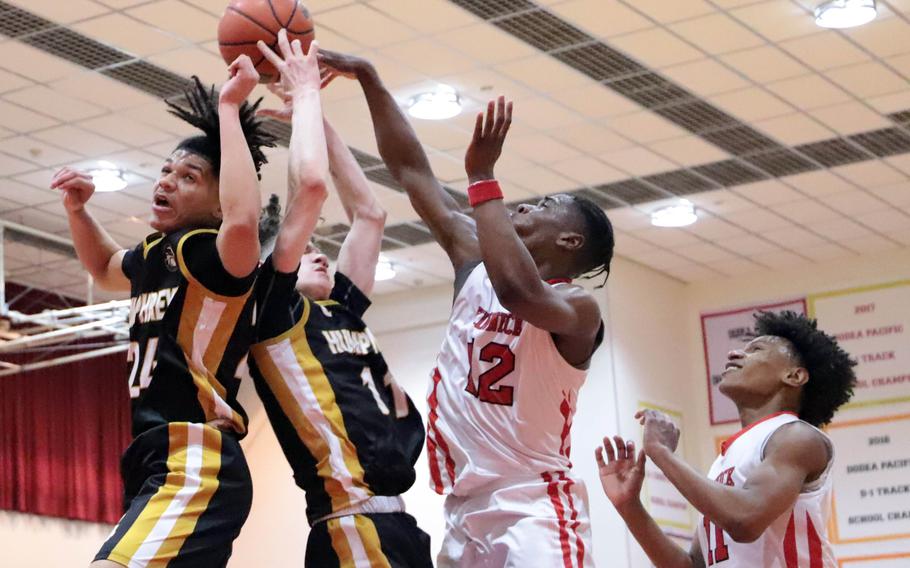 Nasim el-Delik and Elijah Kidd battle for the ball.