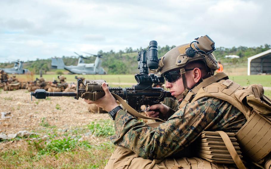 A U.S. Marine posts security during an air-assault exercise at Bloomsbury Airfield in Midge Point, Australia, June 28, 2023.