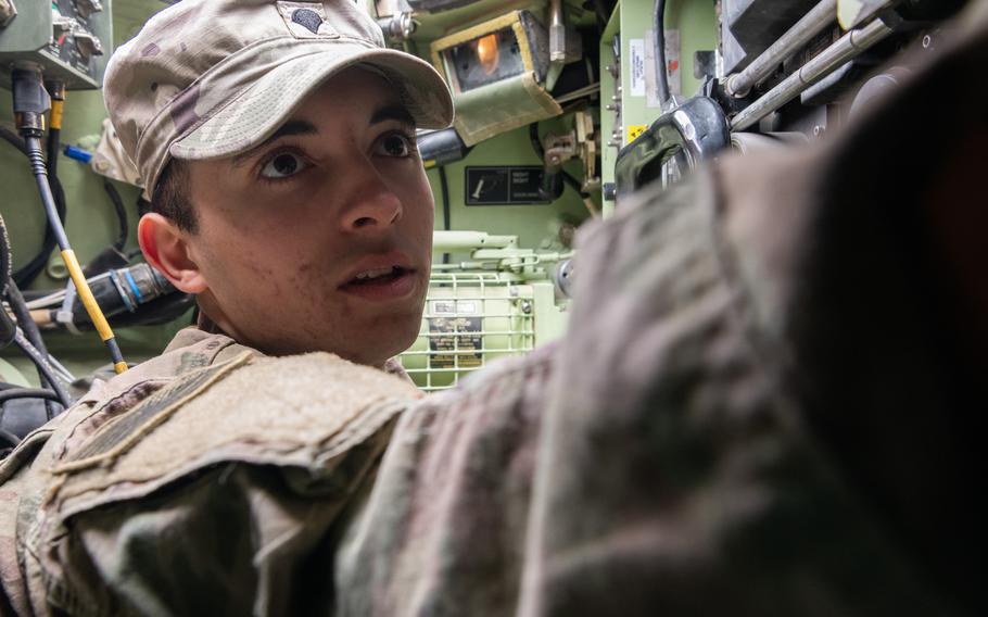 A soldier in a Bradley Fighting Vehicle.