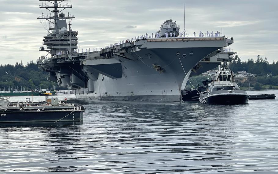 USS Ronald Reagan is pulled by tugboats into Naval Base Kitsap, Wash., on Aug. 13, 2024, after nearly nine years deployed as Navy’s forward carrier in Japan.