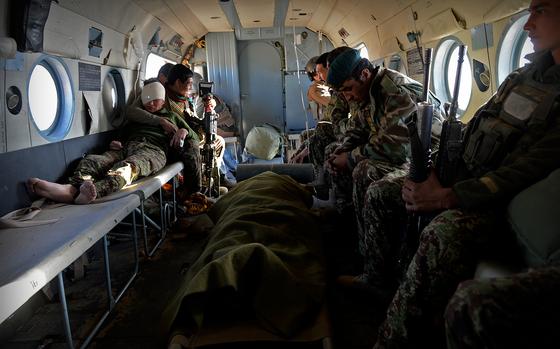 Over Afghanistan, Jan. 6, 2015: Afghan National Army soldiers rest in the back of an Mi-17 helicopter after being evacuated from a remote outpost in southern Afghanistan. As coalition air support has dwindled to almost nothing, the few Afghan Air Force helicopters are in high demand.

On Jan.1, 2015 the NATO-led coalition transitioned to a mission focused more on advising and training than combat operations, but for hundreds of thousands of Afghan security forces and their remaining foreign advisers, the fighting is far from over.

While embedded with the Afghan soldiers and air crews continuing that fight across what was once the Taliban heartland, Stars and Stripes gained an exclusive look at what the war looks like after the withdrawal of most international forces.

Read the story here. https://www.stripes.com/theaters/middle_east/the-war-we-leave-behind-afghan-forces-continue-fight-1.324603

META TAGS: Operation Enduring Freedom; Afghanistan; Wars on Terror; casualties; Afghan National Army; Afghan National Air Force; 