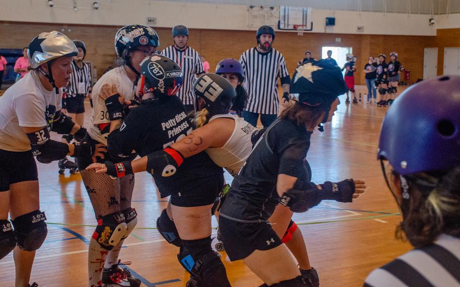 The Vampires and Werewolves roller derby teams compete inside Purdy Gym at Yokosuka Naval Base, Japan, June 17, 2023.