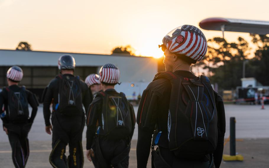 Sgt. 1st Class Jeshua Stahler of the U.S. Army Parachute Team prepares to board an airplane