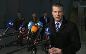 Defense Secretary Pete Hegseth speaks to reporters at NATO headquarters .