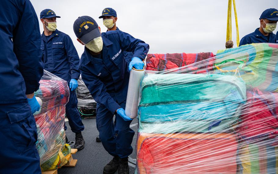 Crew members from the U.S. Coast Guard Cutter Munro (WMSL 755) offload 33,768 pounds of cocaine in San Diego, May 28, 2024. 