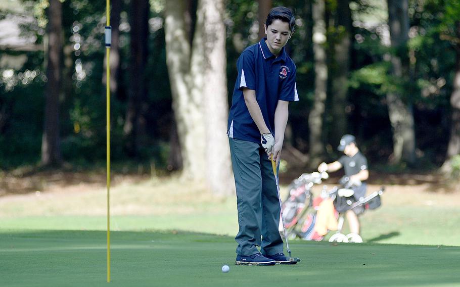 Lakenheath's Micah Rothas putts on the first green of Woodlawn Golf Course on Ramstein Air Base, Germany, during the second day of the DODEA European golf championships on Oct. 13, 2023.