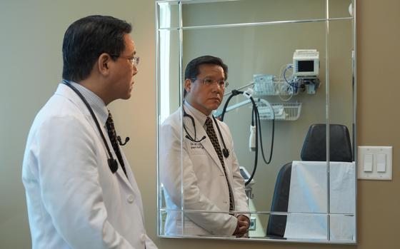 Dr. Doug Chin, who has helped provide medical assistance to people in Afghanistan via video calls, and helped Afghan families with their day-to-day living expenses, stands for a portrait at his practice in Oakland, Calif., on Tuesday, July 30, 2024. 