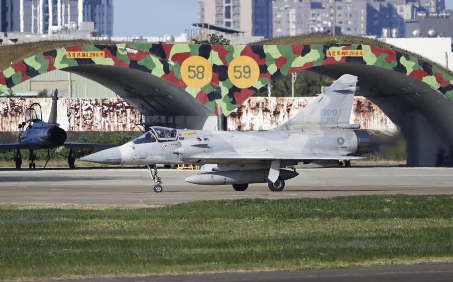 A fighter jet is shown on a runway.