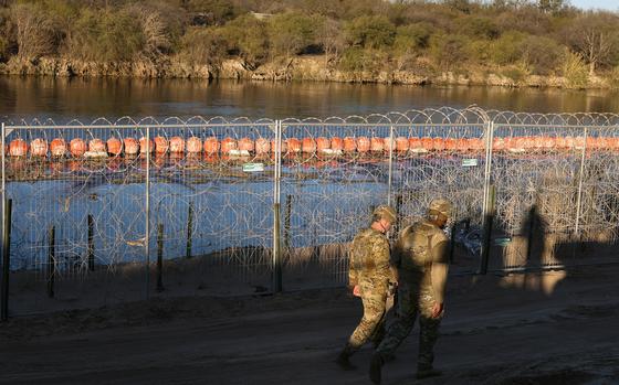 US Army soldiers patrol the US-Mexico border at Eagle Pass, Texas, on Jan. 24, 2025. US President Donald Trump ordered 1,500 more military personnel to the border with Mexico as part of a flurry of steps to tackle immigration, his spokeswoman said on January 22. Border security is a key priority for the president, who declared a national emergency at the US frontier with Mexico on his first day in office, and the additional personnel will bring the total number of active-duty troops deployed there to around 4,000. (Charly Triballeau/AFP/Getty Images/TNS)