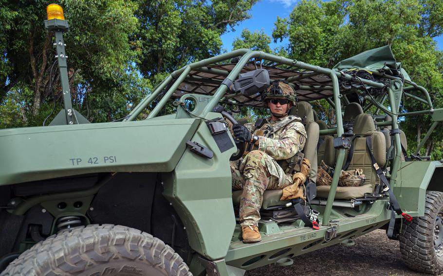 A soldier sits behind the wheel of a new Infantry Squad Vehicle.