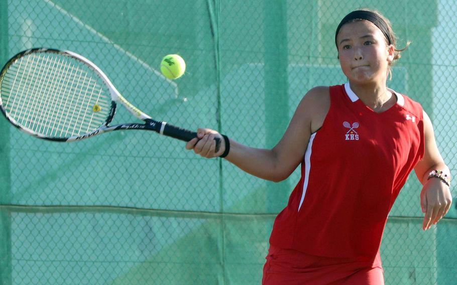 Nile C. Kinnick's Sarah Lame returns against Christian Academy Japan's Audrey Yang during Wednesday's Kanto Plain tennis matches. Lame won 8-2 and the Red Devils as a team won 3-2.