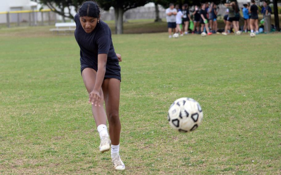 Senior Solares Solano boots the ball.