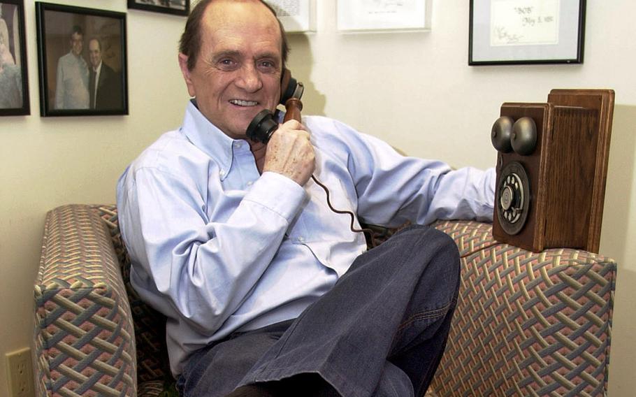 Bob Newhart with a vintage phone in his ear.