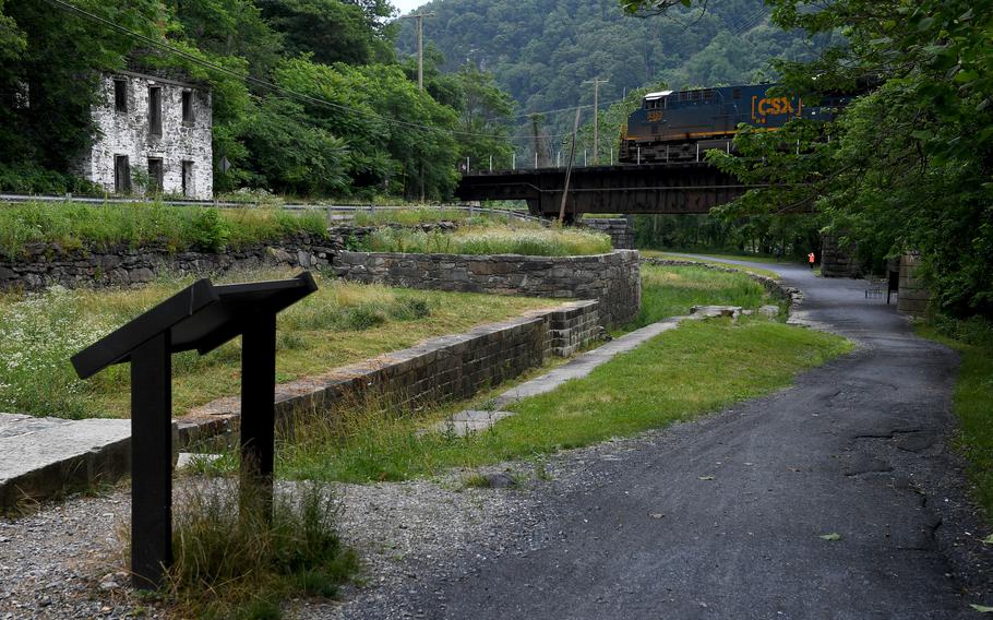 A train passes over the C&O Canal towpath in Harpers Ferry National Historical Park, Md., on June 23, 2020.