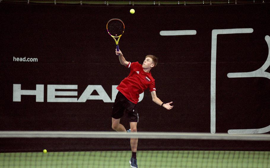 Kaiserslautern's Jace Martin serves during a boys singles semifinal match against Vicenza's Sam Grady during the DODEA European tennis championships on Oct. 20, 2023, at T2 Sports Health Club in Wiesbaden, Germany.