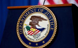 The seal of the Justice Department on a lectern in the department's headquarters briefing room in 2023.