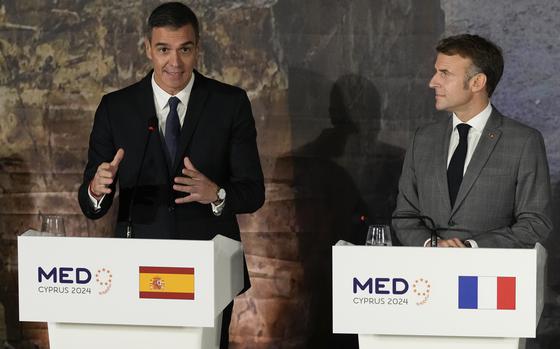 Spain's Prime minister Pedro Sanchez, left, speaks next to French President Emmanuel Macron during a news conference in Paphos ,Cyprus, on Friday, Oct 11, 2024 as the leaders of nine southern European Union member countries and Jordan are meeting to come up with ways of de-escalating the conflict in the Middle East (AP Photo/Petros Karadjias)