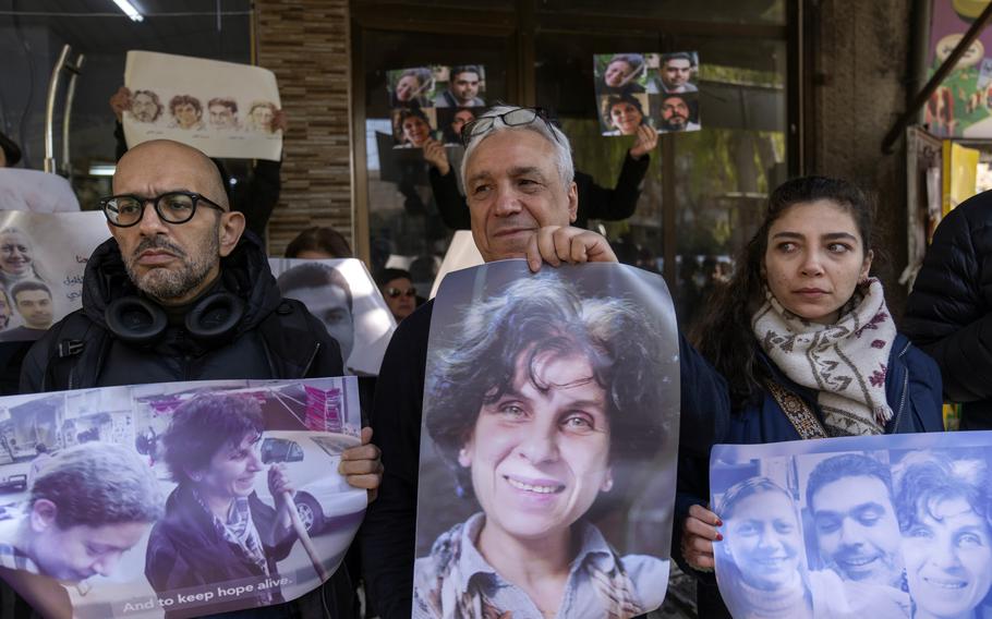 Relatives take part in a protest demanding the whereabouts of four activists who disappeared during the war between opposition groups and former President Bashar Assad’s forces, in Douma, Syria, Wednesday, Jan. 1, 2025. 