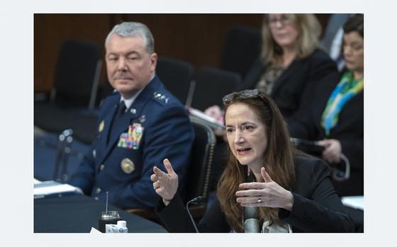 Avril Haines, right, director of National Intelligence, speaks as Lt ...