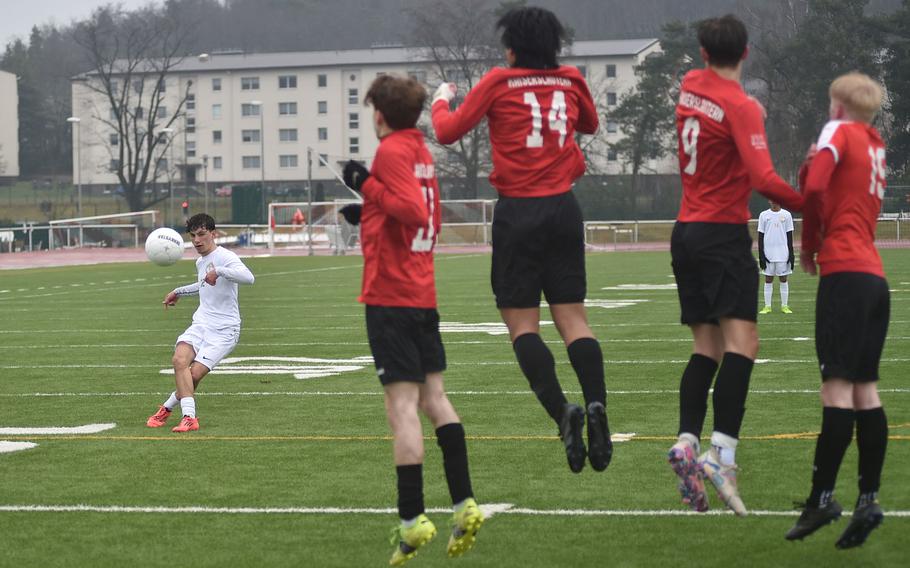 Keiran Goodall tries to kick around a wall of defenders.