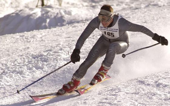 HED: Swishing down the slope, 2003

Garmisch, Germany, Mar. 1, 2003: Mark Marchant races down the piste in the ski giant slalom event at the 2003 U.S. Forces Europe Ski and Snowboard Series in Garmish.  Marchant captured the Mens' Military Masters class with a time of 1:32.44. About 200 skiers and snowboarders are participating in the two-day event on the Huasber slopes in Garmisch, Germany.  

Wondering where you can hit the slopes? Check out Stars and Stripes' community sites for ski pistes near you. https://www.stripes.com/communities/

META TAGS: Travel; holidays; christmas; hanukkah; weekend getaways; skiing; winter sports; 