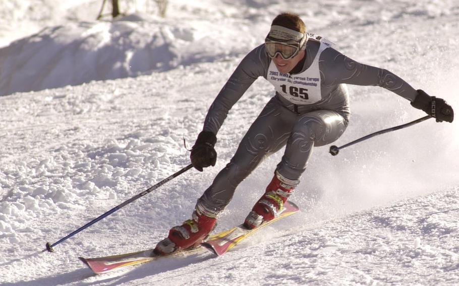 Mark Marchant races down the piste in the ski giant slalom event 