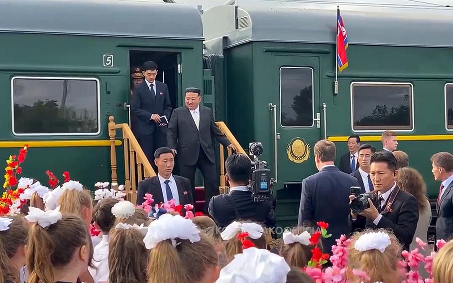 In this photo taken from video released by the governor of the Russian far eastern region of Primorsky Krai Oleg Kozhemyako’s telegram channel on Saturday, Sept. 16, 2023, North Korea’s leader Kim Jong Un, center, steps down from his train after arriving in Vladivostok, Russian Far East.