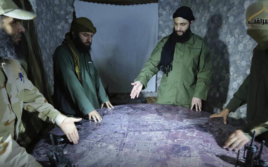 Abu Mohammed al-Golani discussing battlefield details with commanders