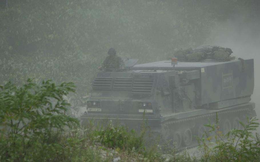 A (MLRS) multiple launch rocket system vehicle heads up range