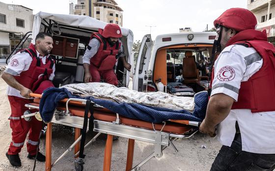 Palestine Red Crescent Society responders retrieve the body of a man found dead at the Nur a-Shams refugee camp during an IDF operation in the northern West Bank on Aug. 29, 2024.