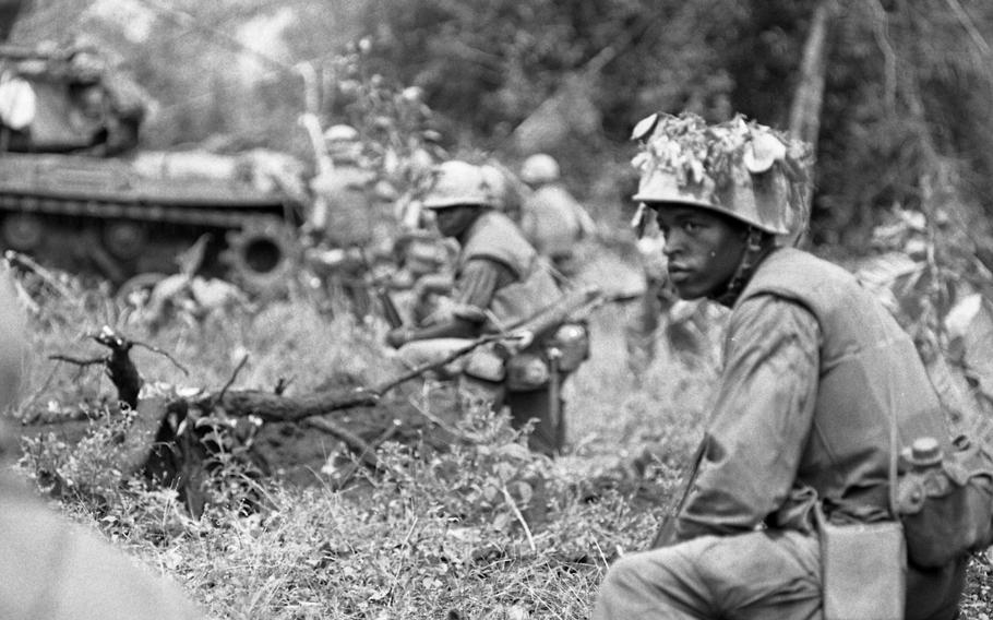 A U.S. Marine scanning the perimeter for any enemy activity