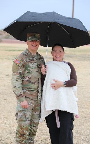 More than 150 service members of the 856th Military Police Company from the Arizona Army National Guard rally together with their families on Bushmaster Field in Phoenix, Ariz., for an send-off ceremony Sunday, Jan. 21, 2024. 