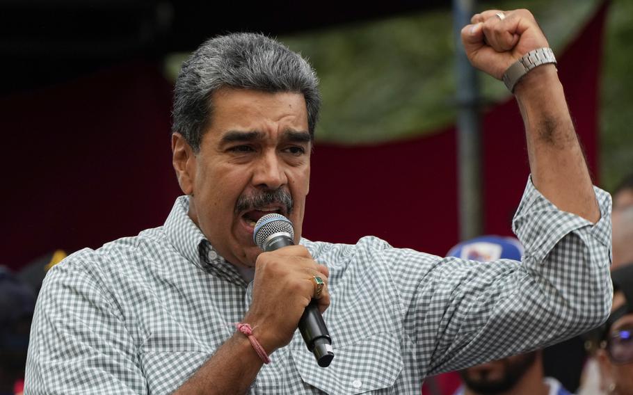 Venezuela's President Nicolas Maduro addresses government loyalists gathered at the presidential palace in support of his reelection one month after the presidential vote, in Caracas, Venezuela, Aug. 28, 2024.