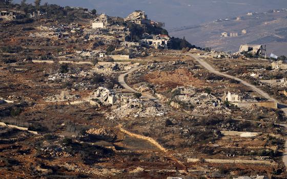 Destroyed buildings in the village of Kfar Kila, southern Lebanon, are seen from northern Israel, Tuesday, Dec. 3, 2024. (AP Photo/Maya Alleruzzo)